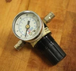 Coil Hose MR1 1/8" Regulator With 8700-160 Pressure Gauge Used. Fixed Price $10.19.