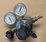 Matheson Regulator 3104A 580 W/ Gauge 63-3122 0-200PSI, 63-3133 0-3000PSI. Fixed Price $90.00.